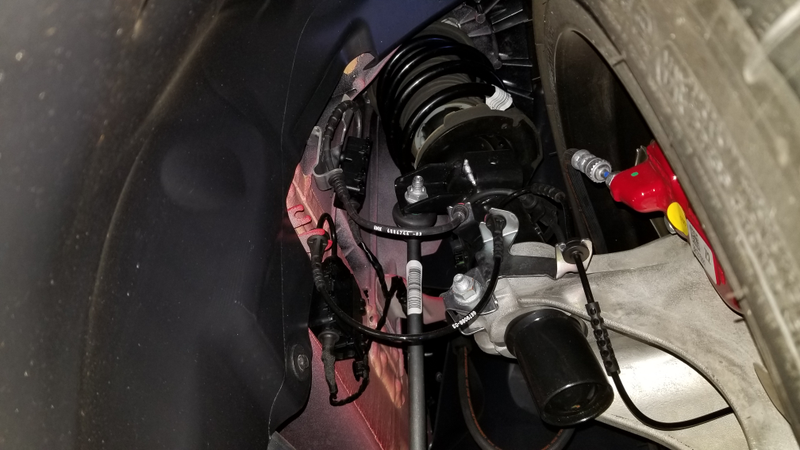 Toyota Supra double-joint spring strut front suspension as viewed from below and in the rear